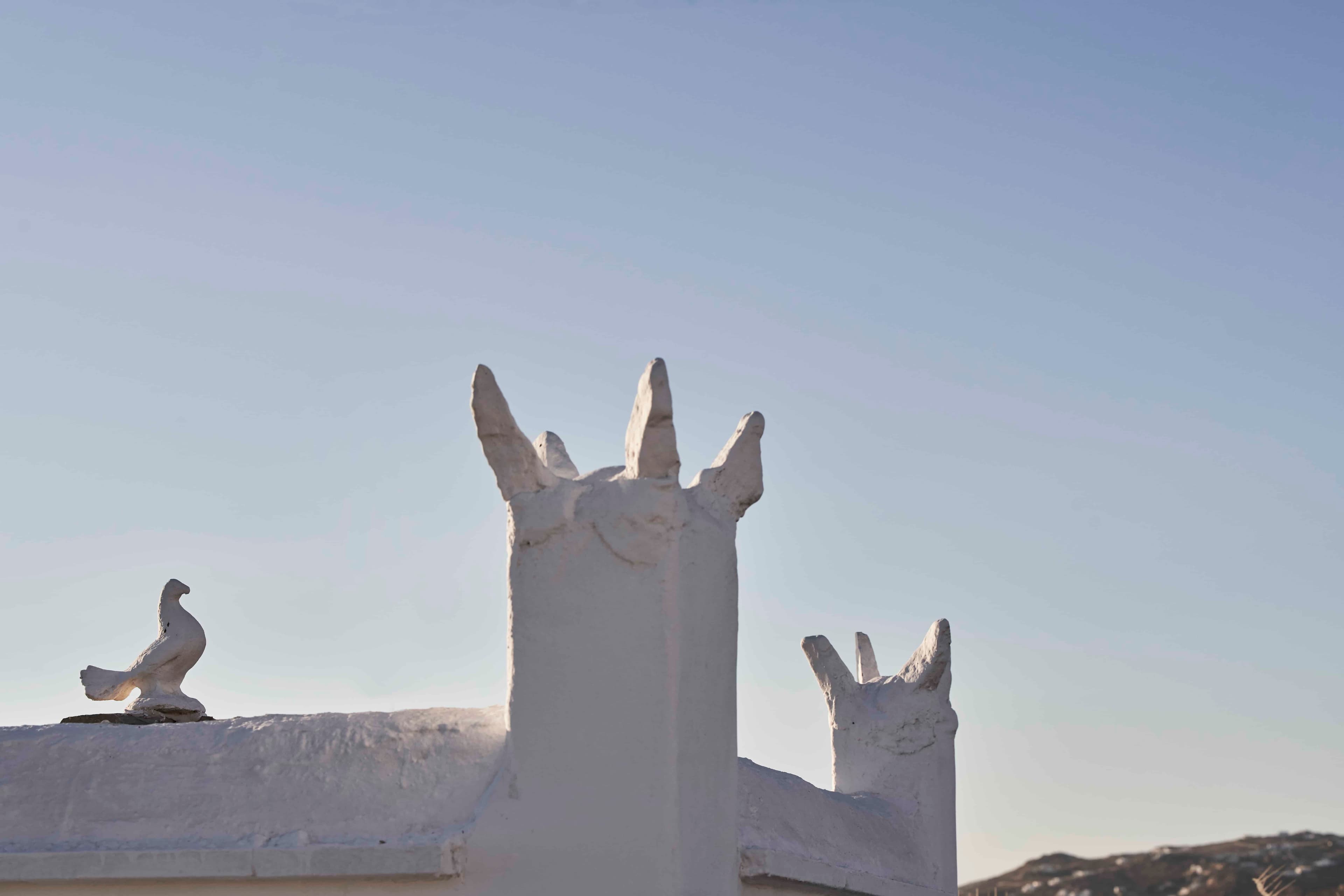 Hotel entrance and facade with traditional white-washed walls
